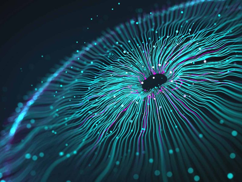 Abstrakte Grafik eines Kreises mit leuchtenden Linien in Blau- und Lilatönen, die von einem dunklen Zentrum ausstrahlen. Die Linien wirken wie elektrische Impulse vor einem dunklen Hintergrund. Kleine, leuchtende Punkte sind über das Bild verteilt.